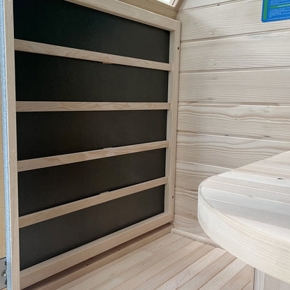 Close view of a carbon far infrared heater panel mounted in the hemlock wall