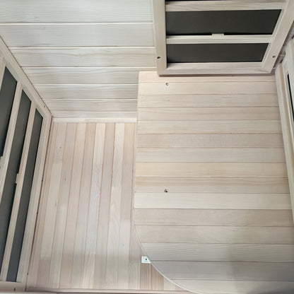 Slatted hemlock floor and bench inside the 1-person infrared sauna